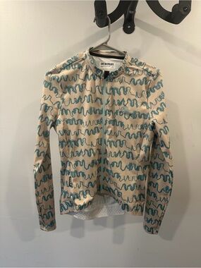 Café du Cycliste Men’s Beige Cycling Shirt with Teal Pattern